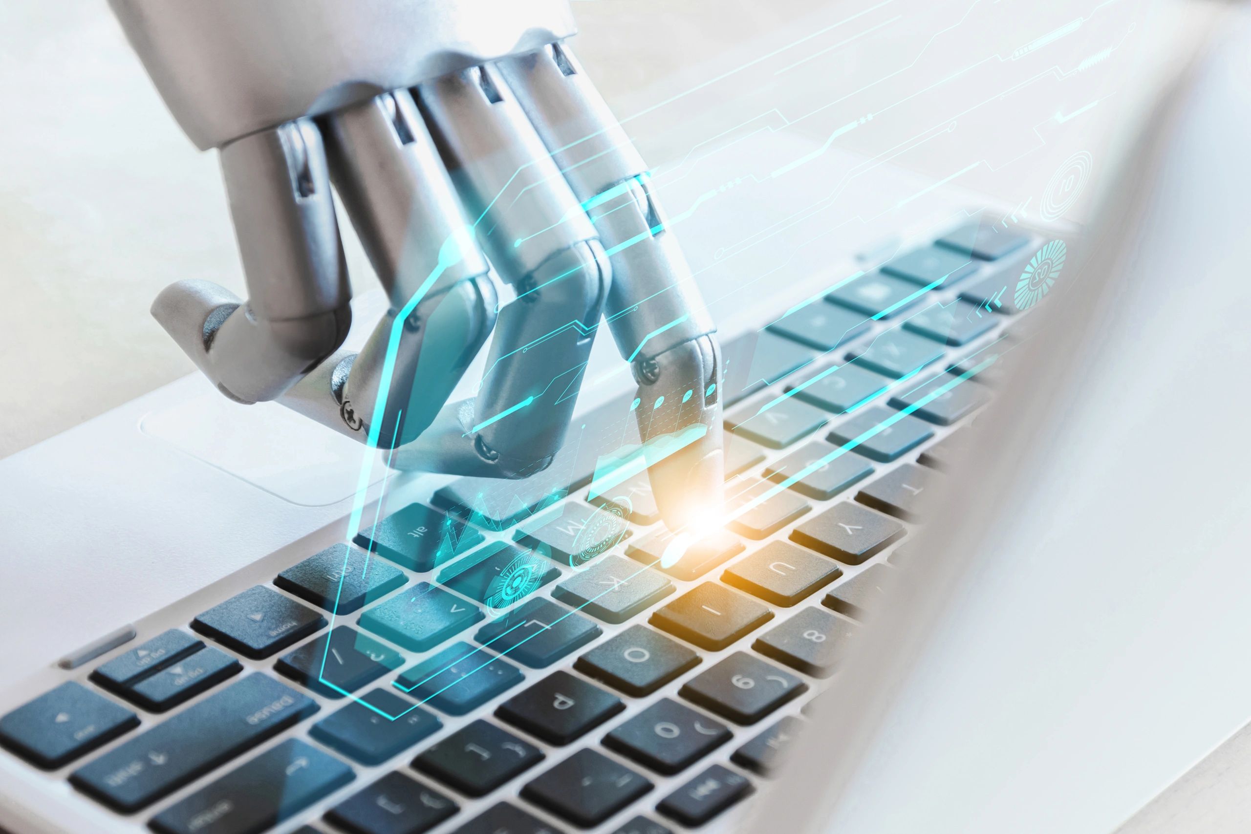 Robot hands and fingers point to laptop button